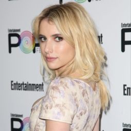 emma roberts wearing a floral dress with bleached blonde long hair