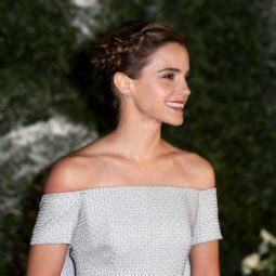 Emma Watson with a plaited updo in her brunette hair on the red caret wearing a pale blue gown