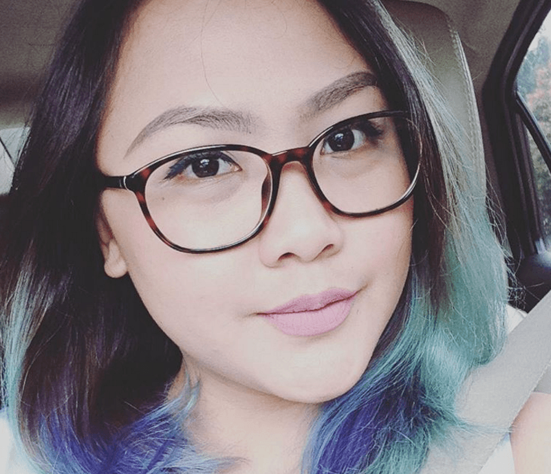 woman with glasses with black hair with ombre