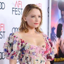 Haley Bennett with shoulder length hair wearing a floral dress on the red carpet