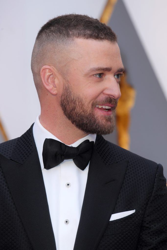 justin timberlake with short hairstyle in black suit and bow tie at the 89th Academy Awards