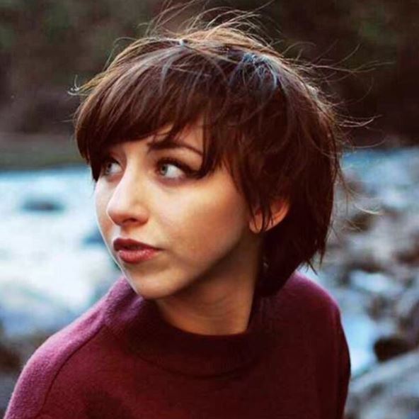 woman with grown out long brown pixie