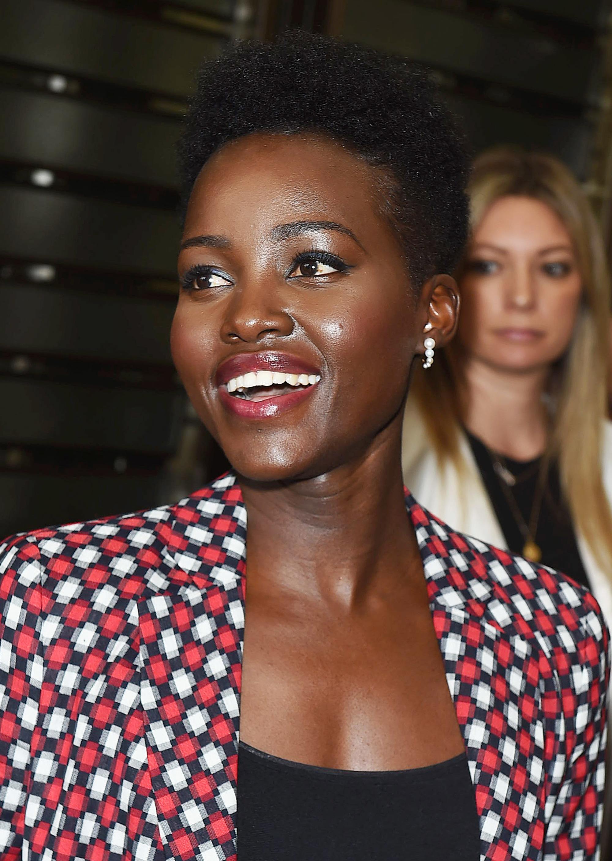 close up shot of lupita nyong'o with high top afro with tapered afro