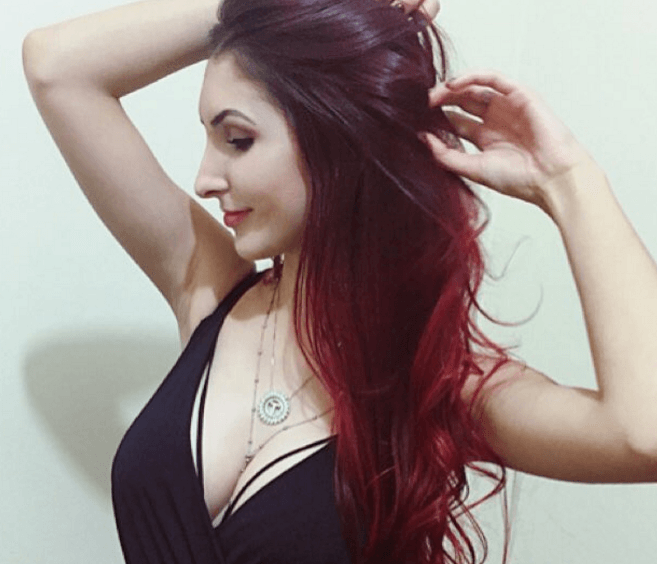 woman with red ombre hair in black top