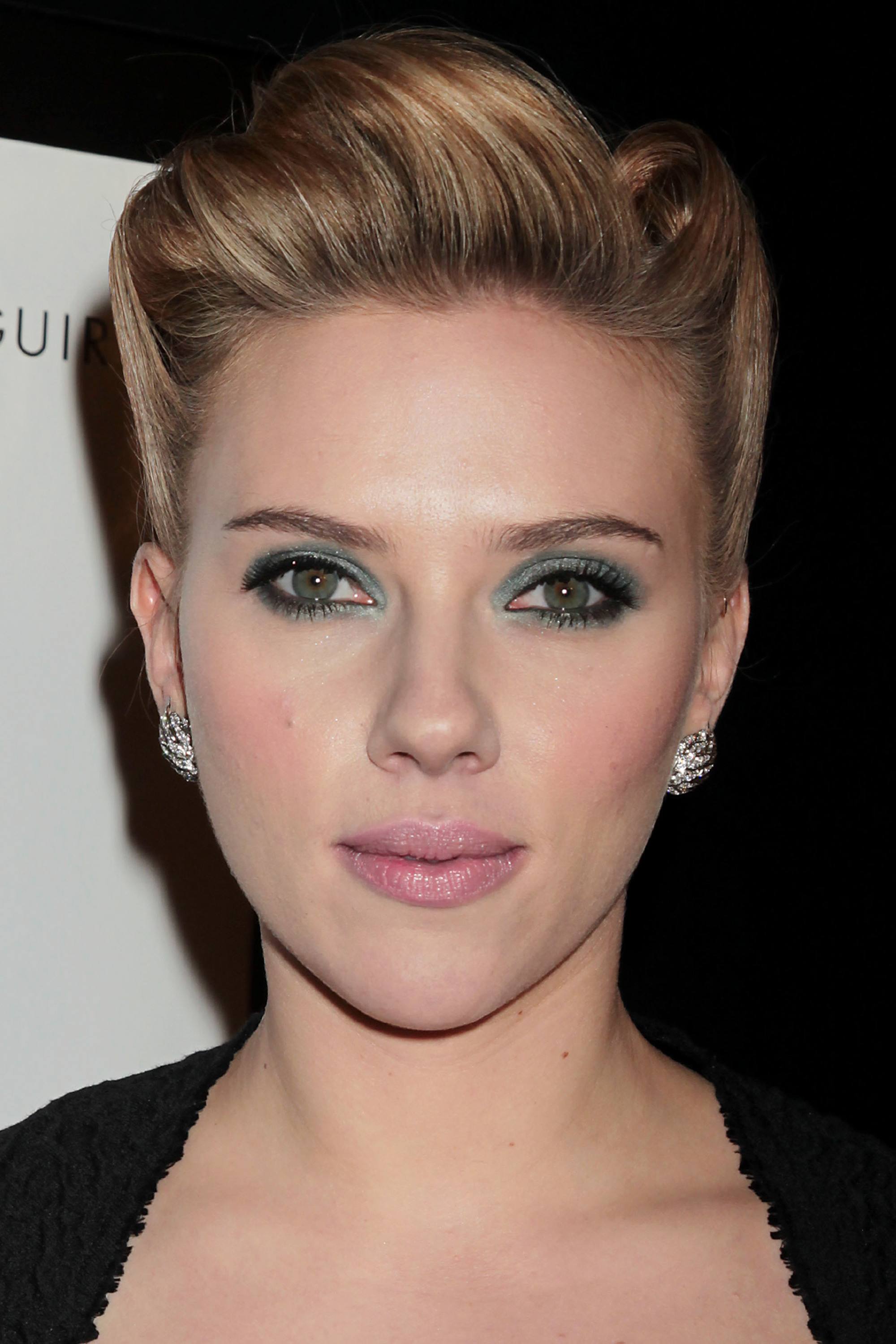 Scarlett Johansson with green eyeshadow and pink lipstick and a rockabilly hairstyle