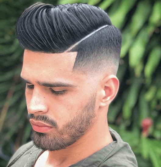 front view image of a man with dark black hair in a quiff