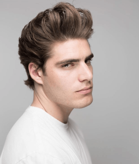 front view image of a man with a voluminous quiff hairstyle