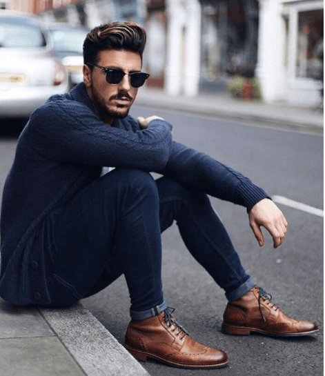 front view image of a man with a quiff hairstyle and trendy clothes