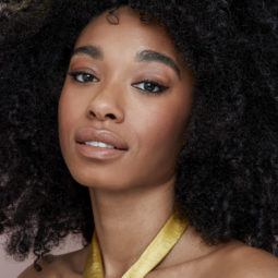 Natural hairstyles for Valentine's Day: Shot of model with big and beautiful natural afro, wearing a yellow dress