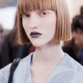 pictures of short hairstyles: model backstage with short bob and blunt bangs