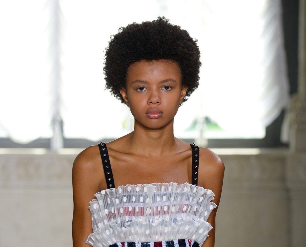short hair fashion: black model with afro hair on the runway