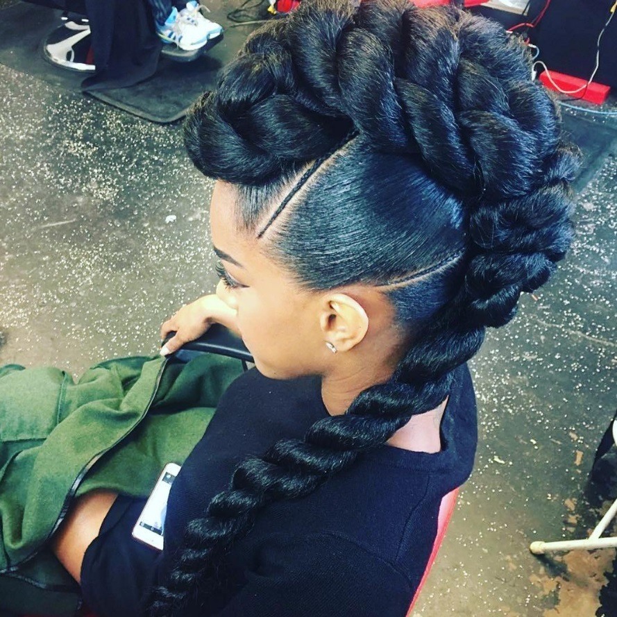 woman with giant braided mohawks