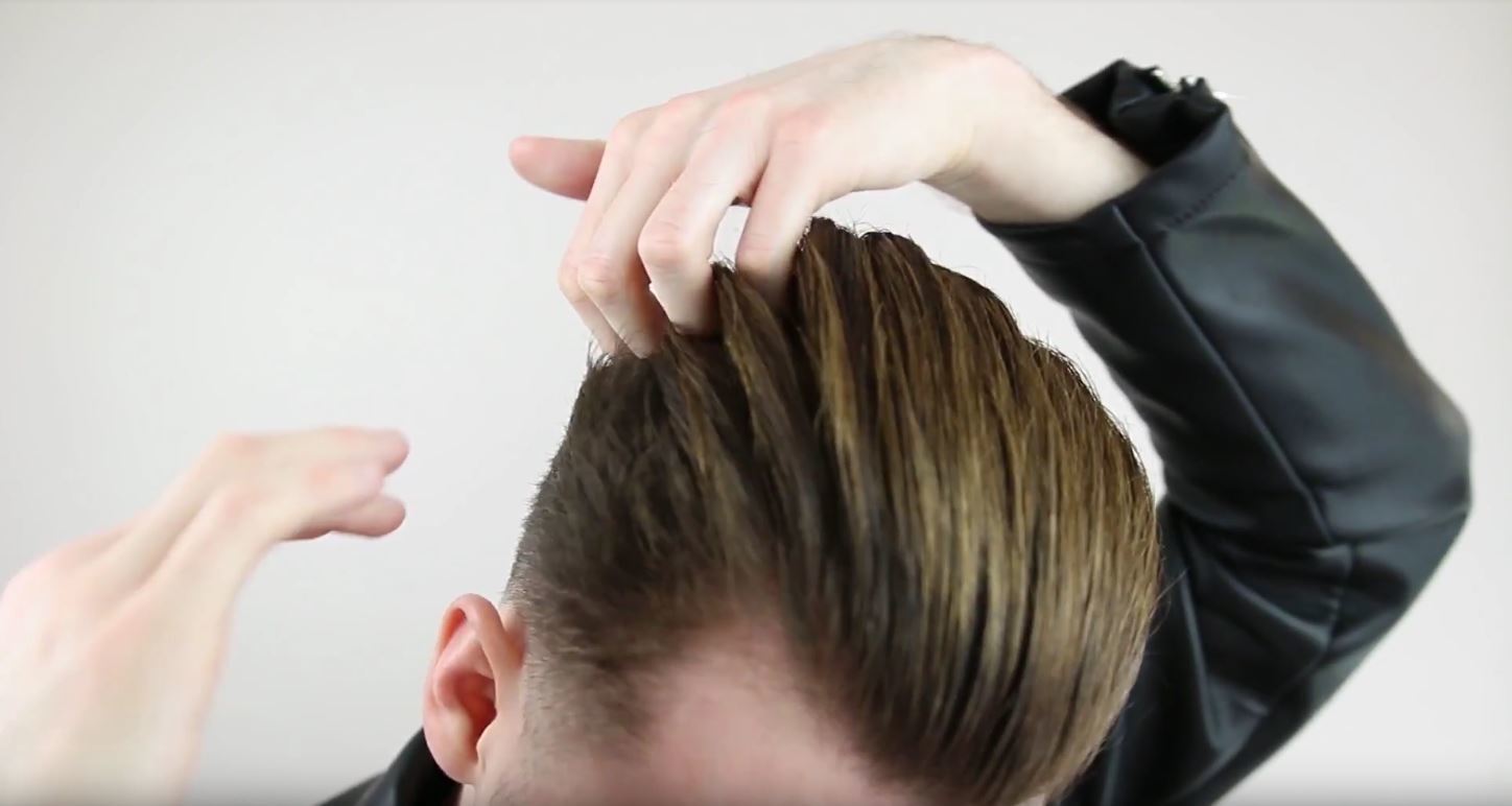How to slick back short hair: Vlogger Jake Daniels running his fingers through his hair