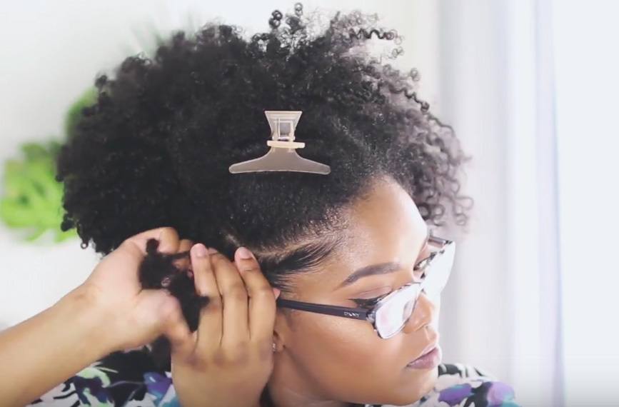 mini marley creating a twist in her natural hair