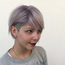 striped undercut designs on woman with lilac hair