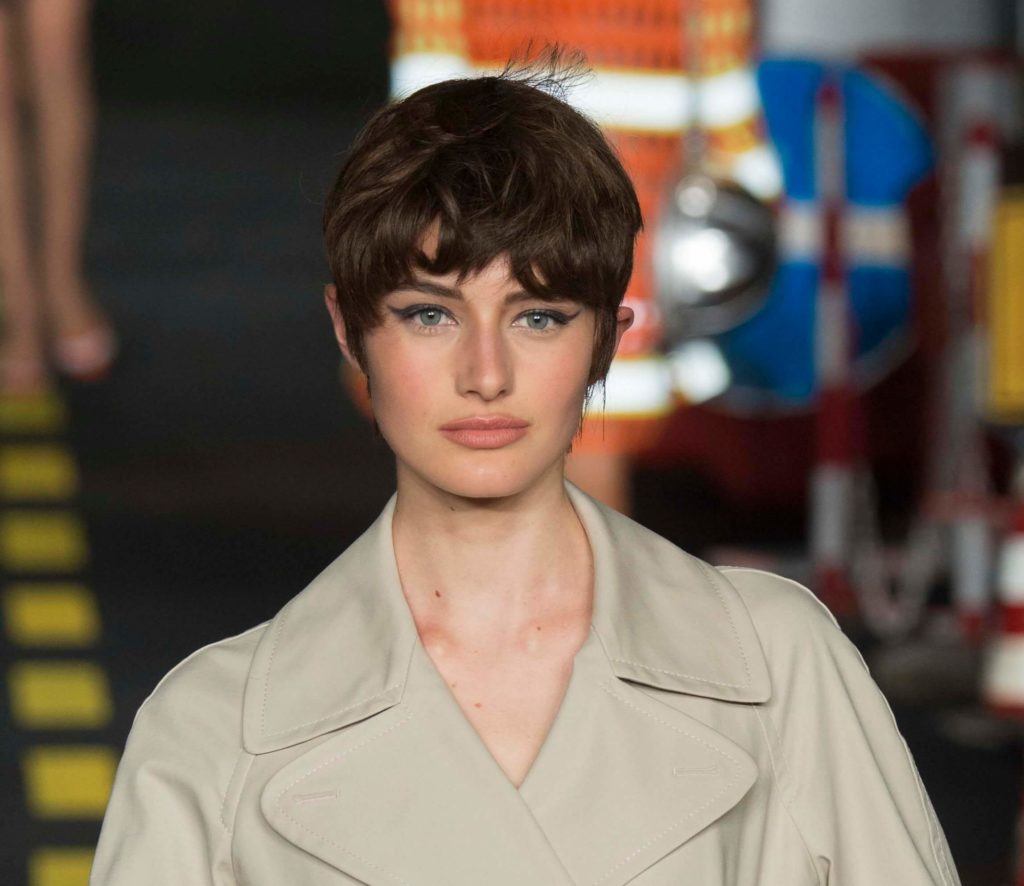 fashion short hairstyles: dark haired model with a messy pixie cut