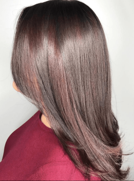 Balayage on dark hair with a hint of red