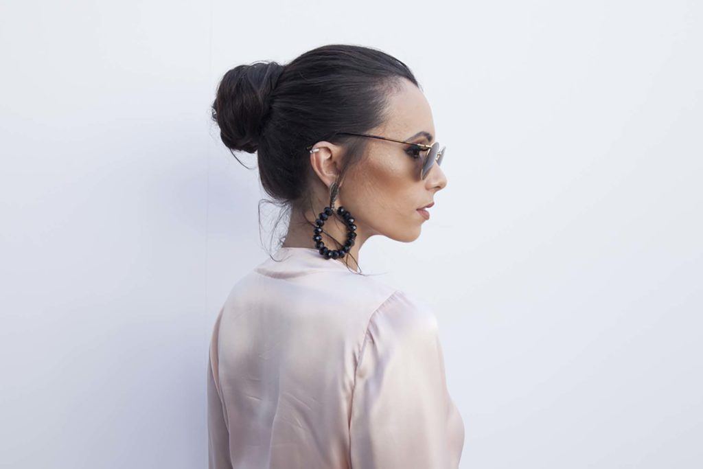 model with long hair 2017 styled into a polished bun