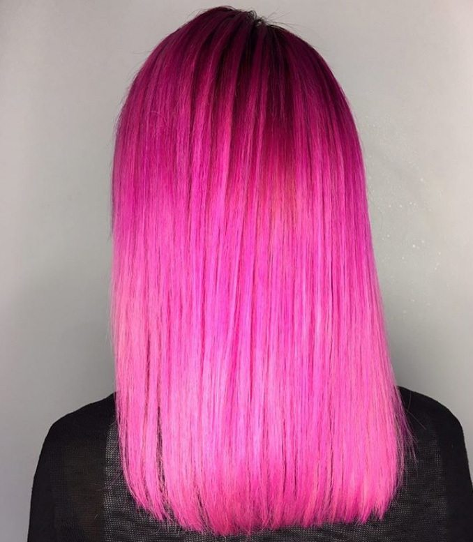 model with neon pink mid length hair