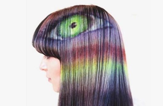 hair model with optical illusion hair designs painted into her brown hair