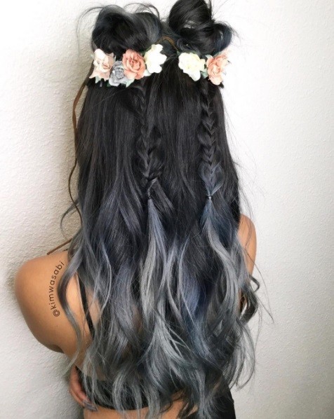 girl with long grey ombre hair with floral braided space buns