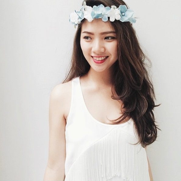 woman wearing a flower crown in her brunette hair