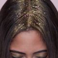 easy coachella hairstyle ideas: model with gold glitter roots