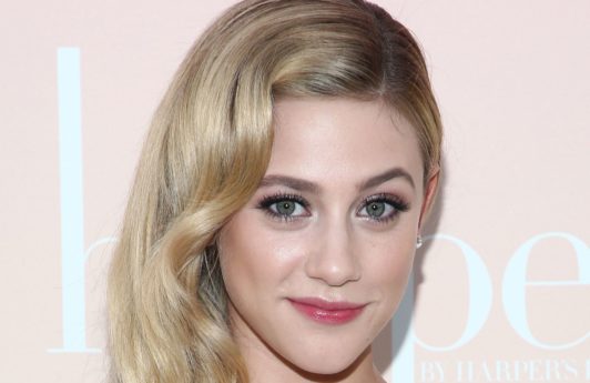 riverdale star lili reinhart with her blonde hair in classic hollywood waves