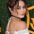 coachella hairstyles: vanessa hudgens with messy halo braid and flowers