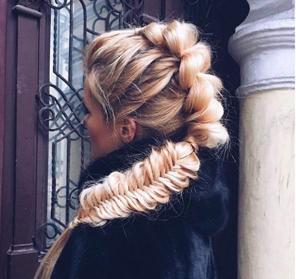 front view image of a woman with a mohawk braid hairstyle in a ponytail