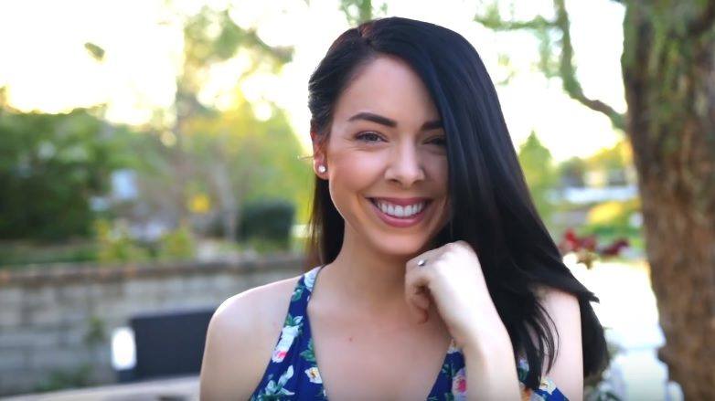 youtube vlogger nikki phillippi with her brunette hair in a straight long bob hairstyle