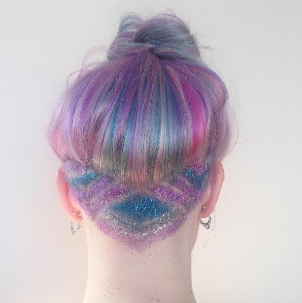 woman with pastel hair and a glittery undercut