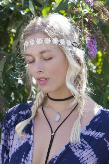 model with blonde pigtails with festival braided hair