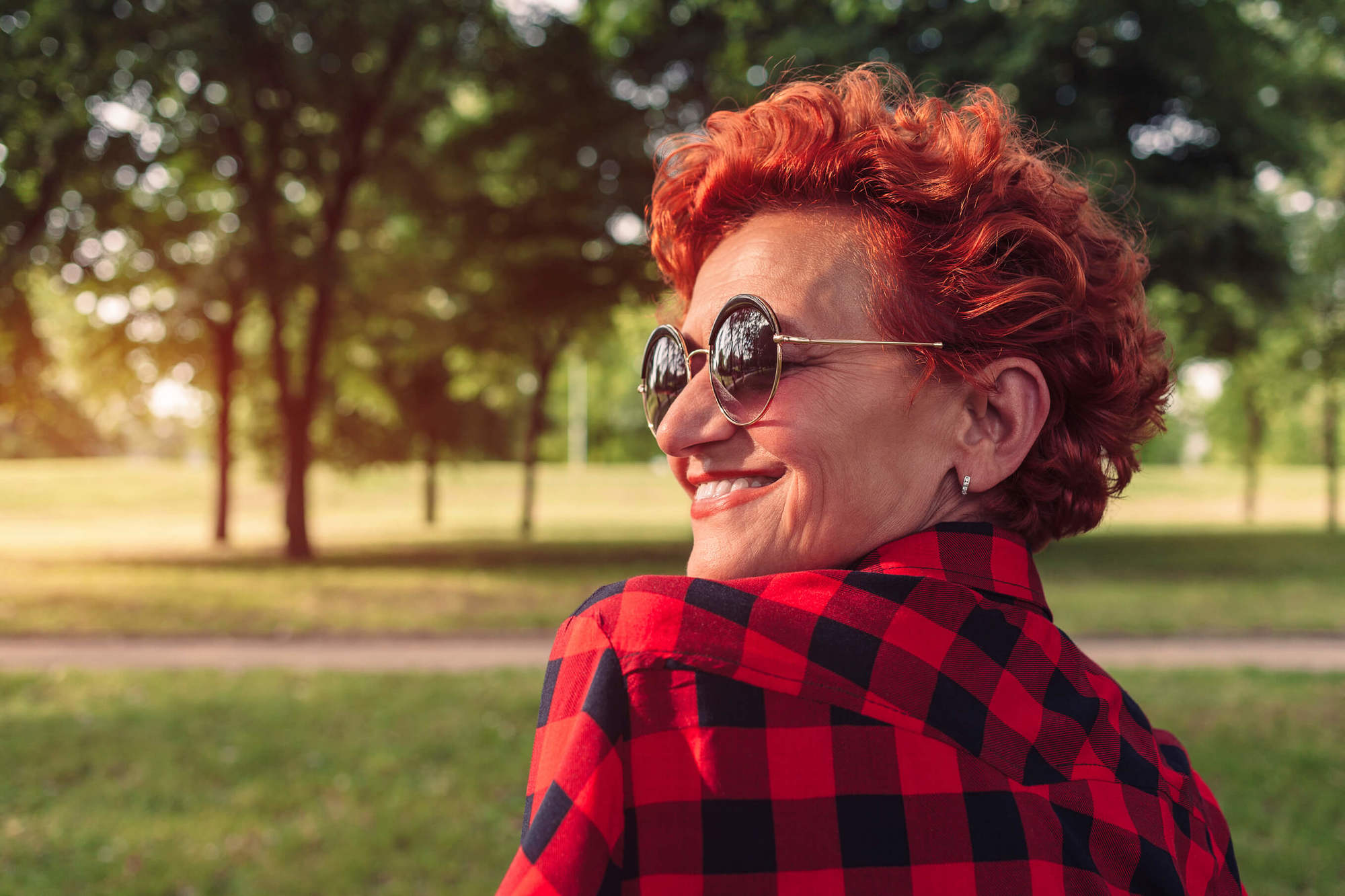 mature redhead woman with a wavy cropped haircut
