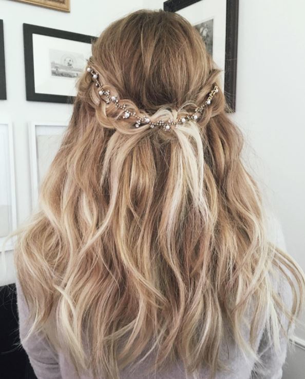 Braided half,up-half,down wavy hairstyle with hair accessory