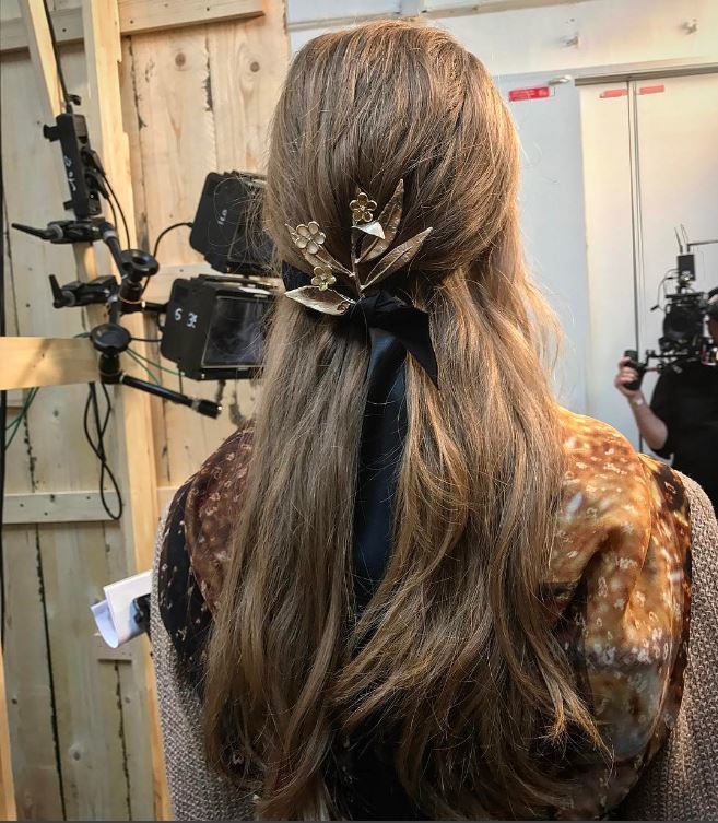 Chanel Cruise hair - half,up hairstyle with gold accessory