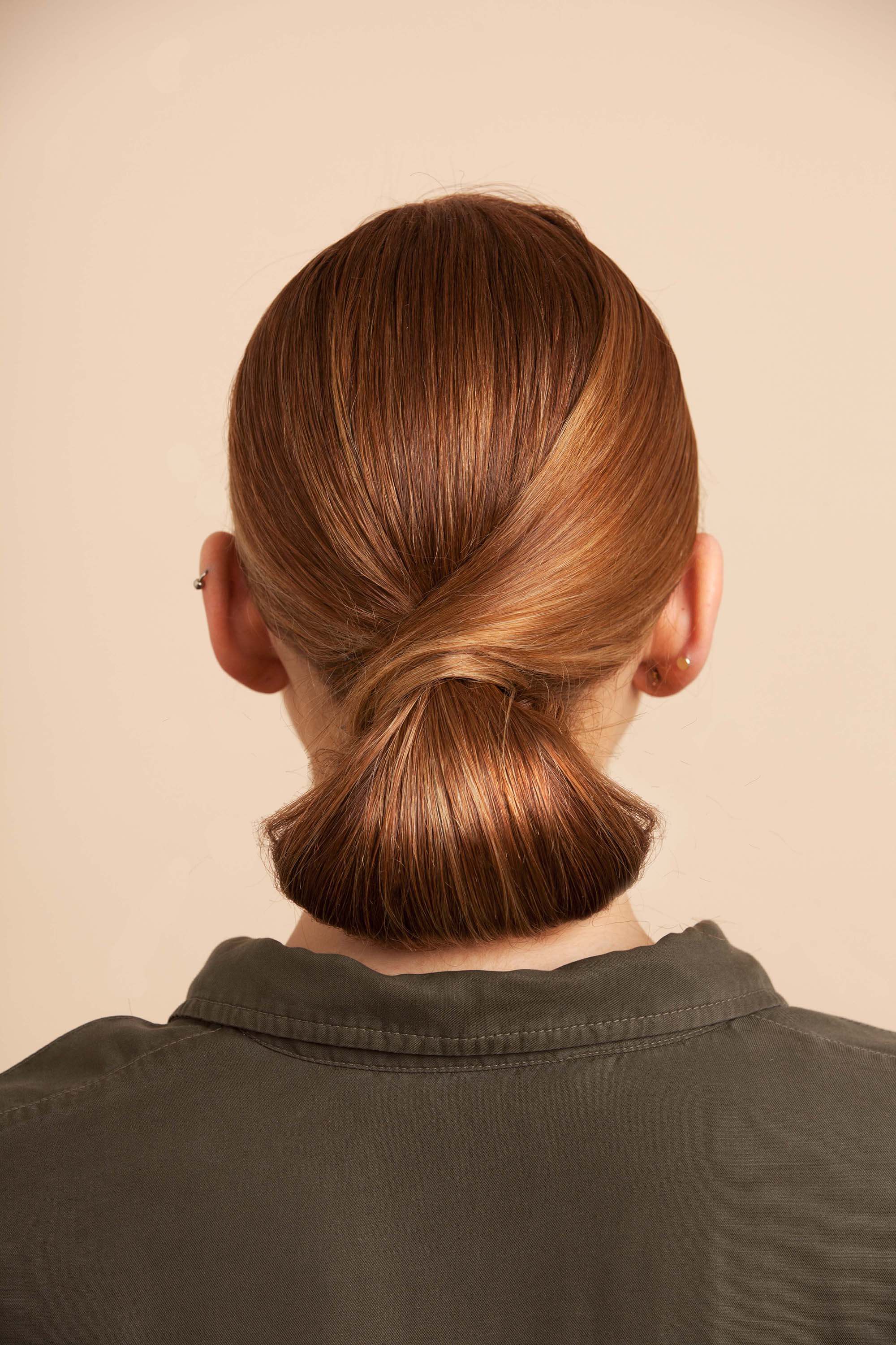 Tucked hairstyle on medium toned brown hair