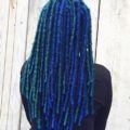 woman with long blue and teal dreadlocks