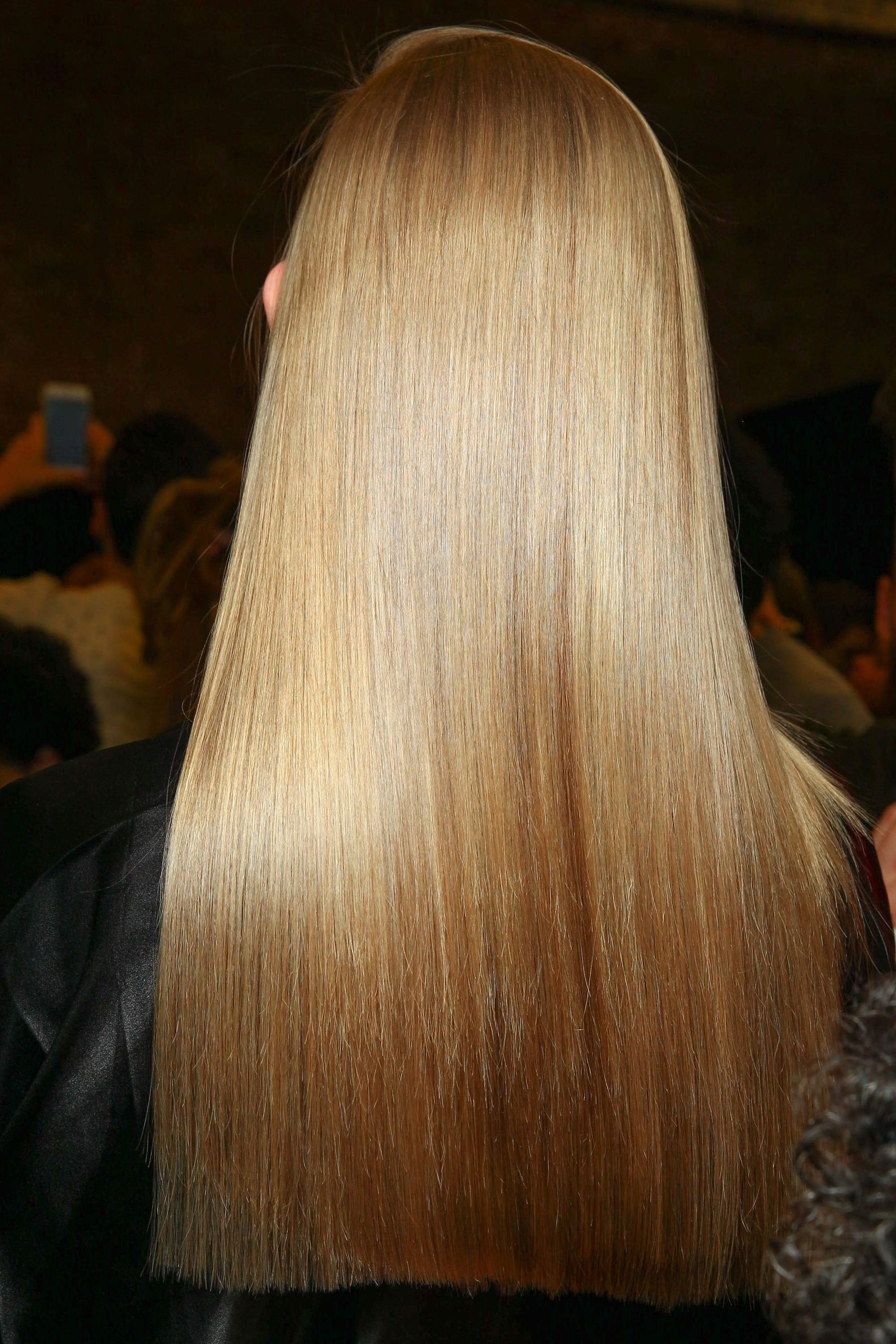 brunette model with super straight long hair - how to straighten curly hair tutorial