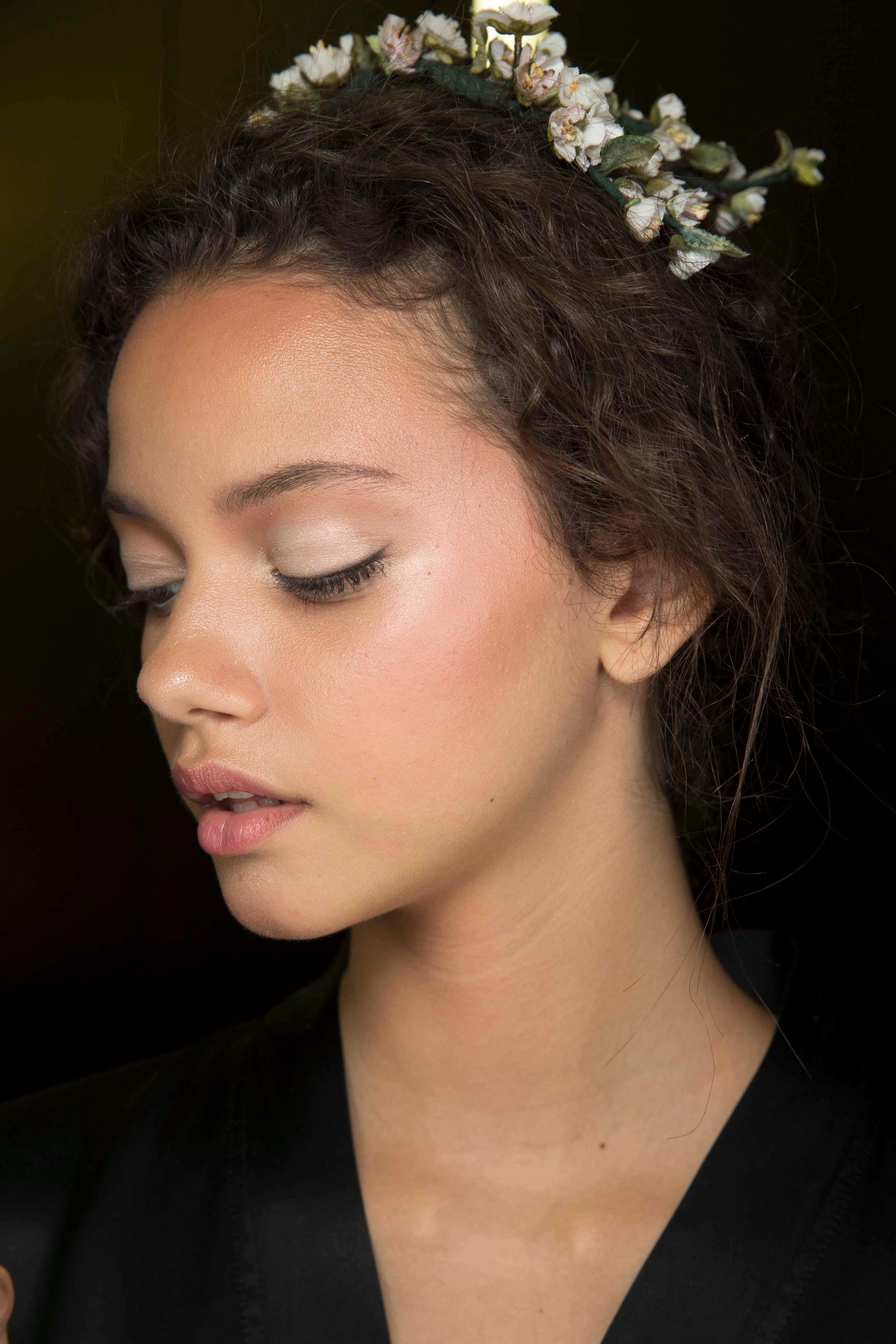 Curly haired model with floral headband