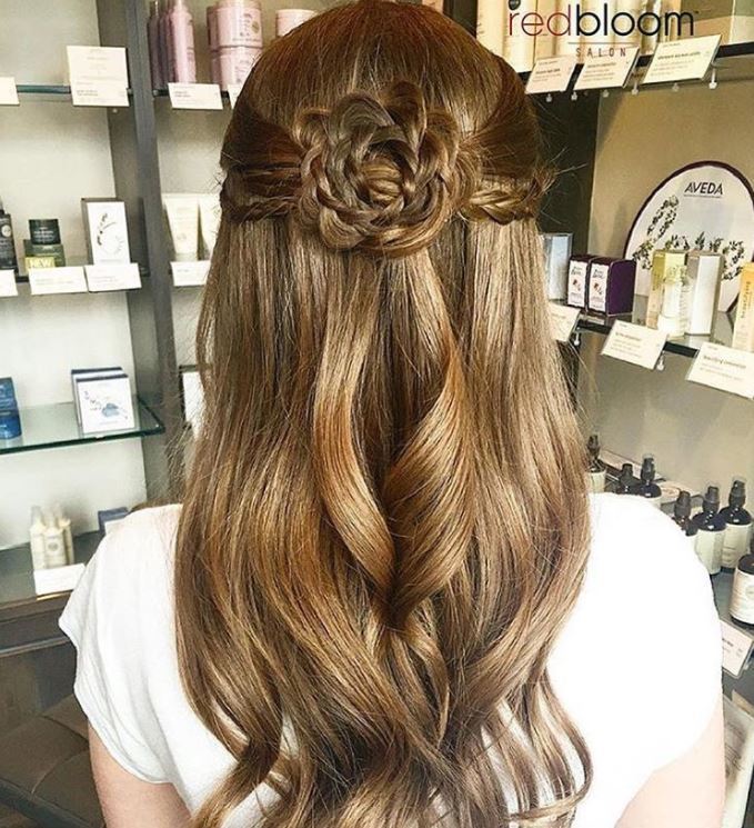Long wavy brown hair with floral braid design
