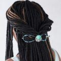 woman with dreadlocks in a twisted half-up style