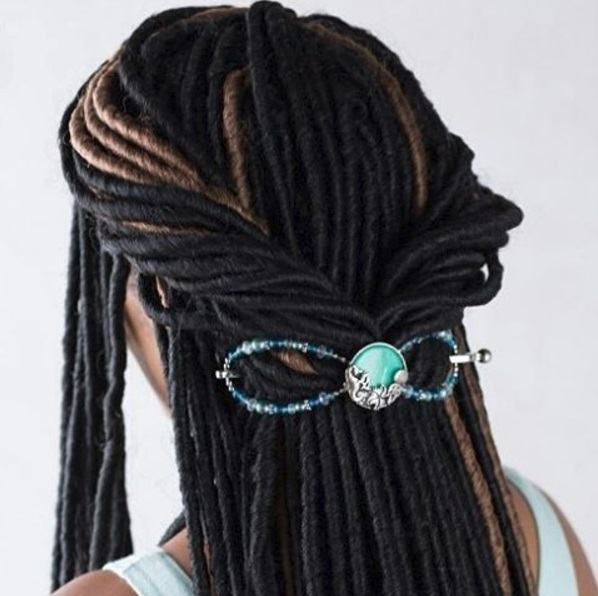 woman with dreadlocks in a twisted half-up style