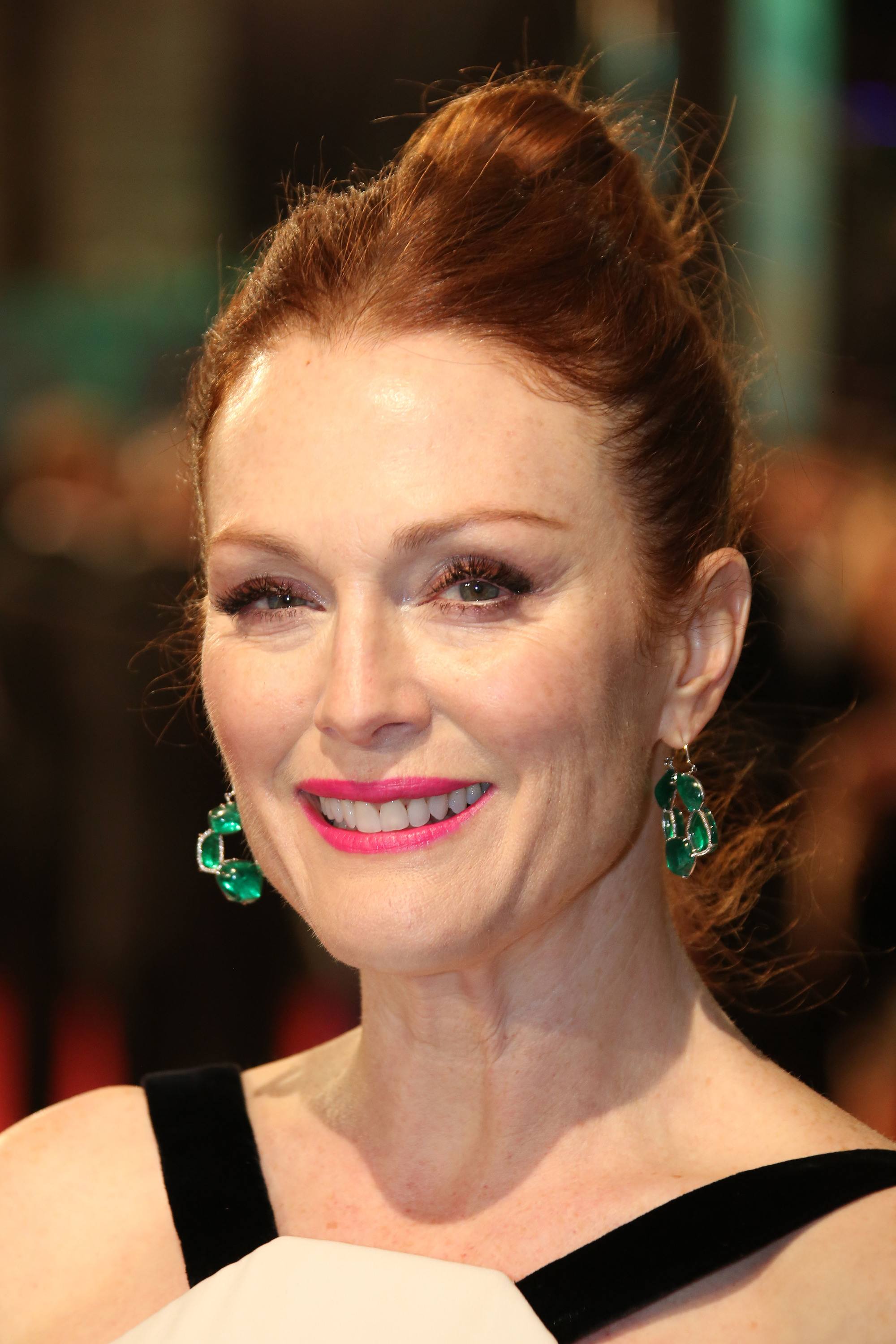 julianne moore with her red hair in a chic high bun