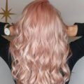 backshot of model with pink peachy pearl hair