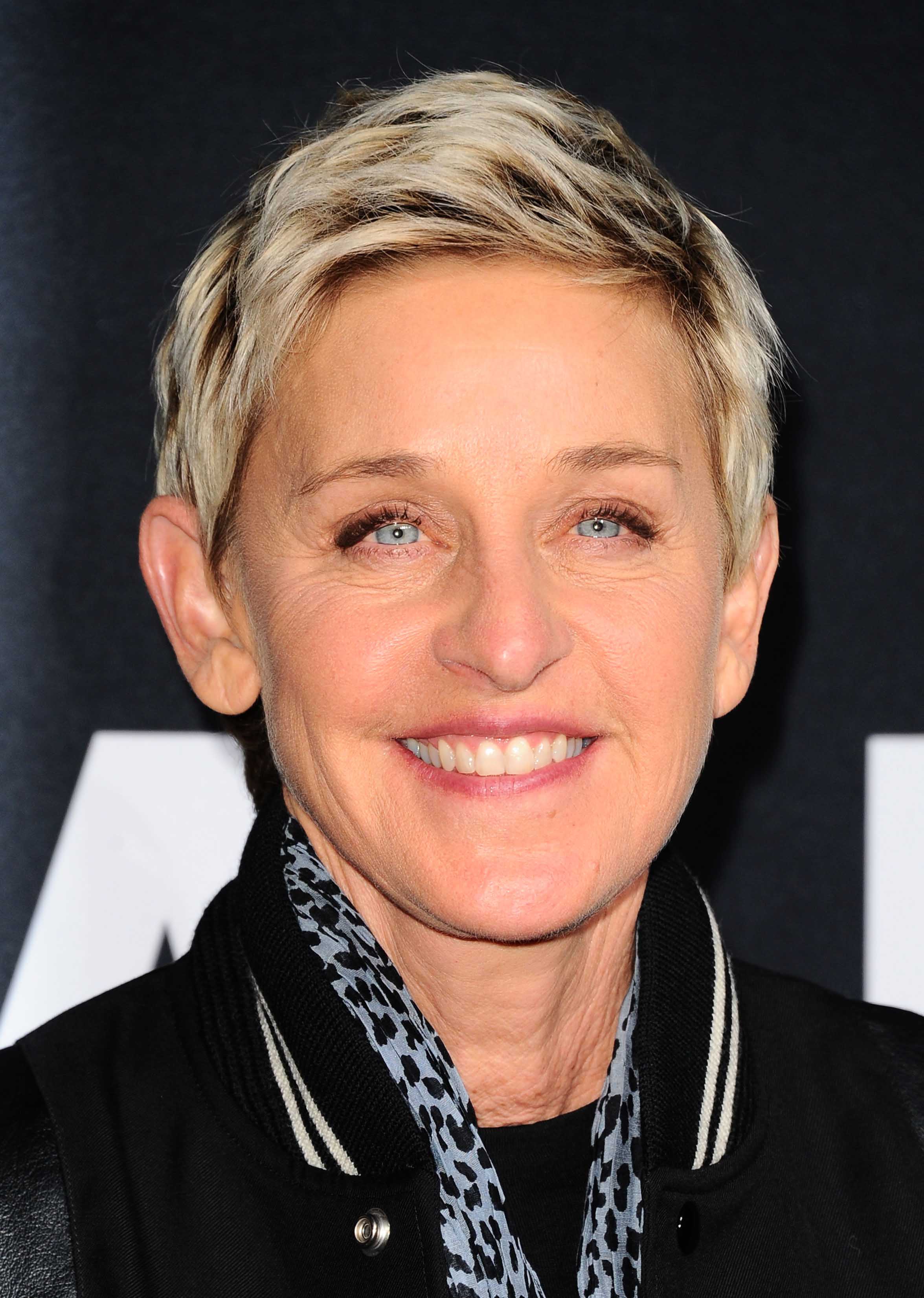 Blonde pixie crop with dark roots hairstyles Ellen DeGeneres. Credit Rex by Shutterstock