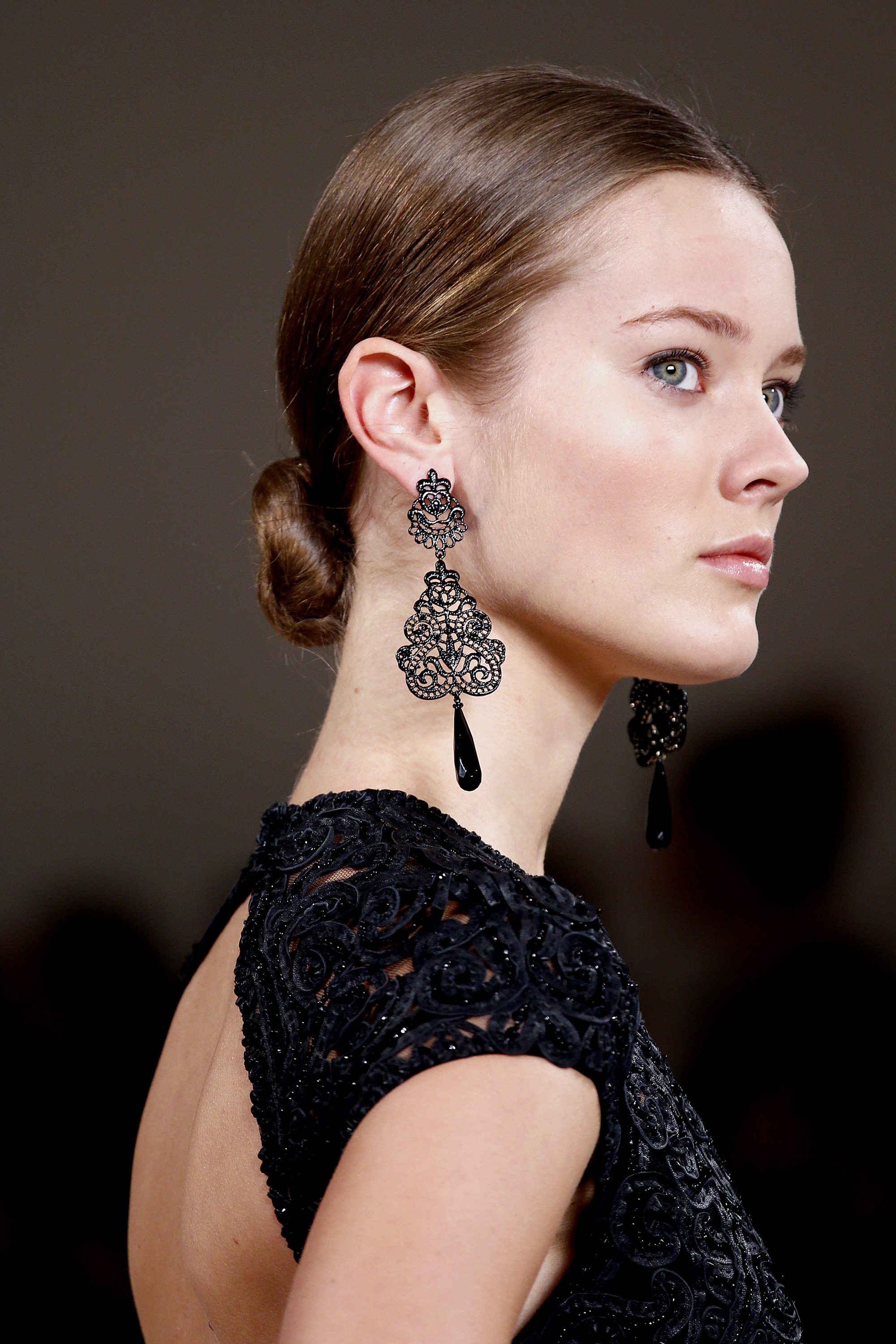 ralph lauren model with her brunette hair in a sleek low bun