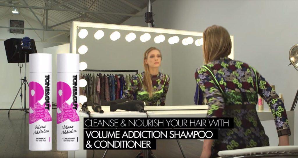 Toni & Guy The Marla - blonde model looking in the mirror with wet hair