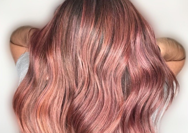woman with pink champagne hair