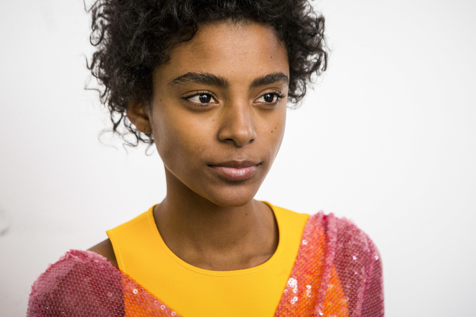 co wash shampoo: model with curly hair backstage at show